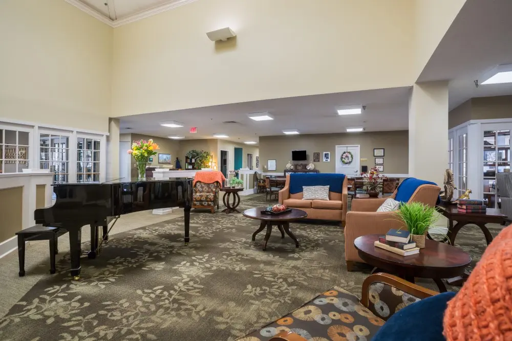 Lobby with piano at American House Murfreesboro, an assisted living facility in Murfreesboro, Tennessee